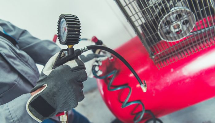 man using dental compressor