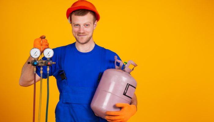 man holding dental air compressor