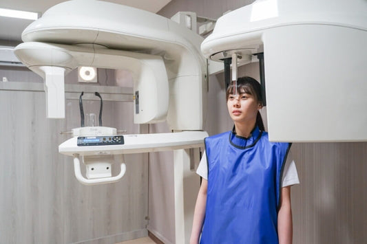 woman receiving dental x-ray